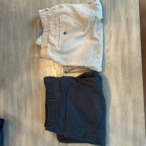 Two pairs of men’s 42x32 pants both never worn and in perfect condition